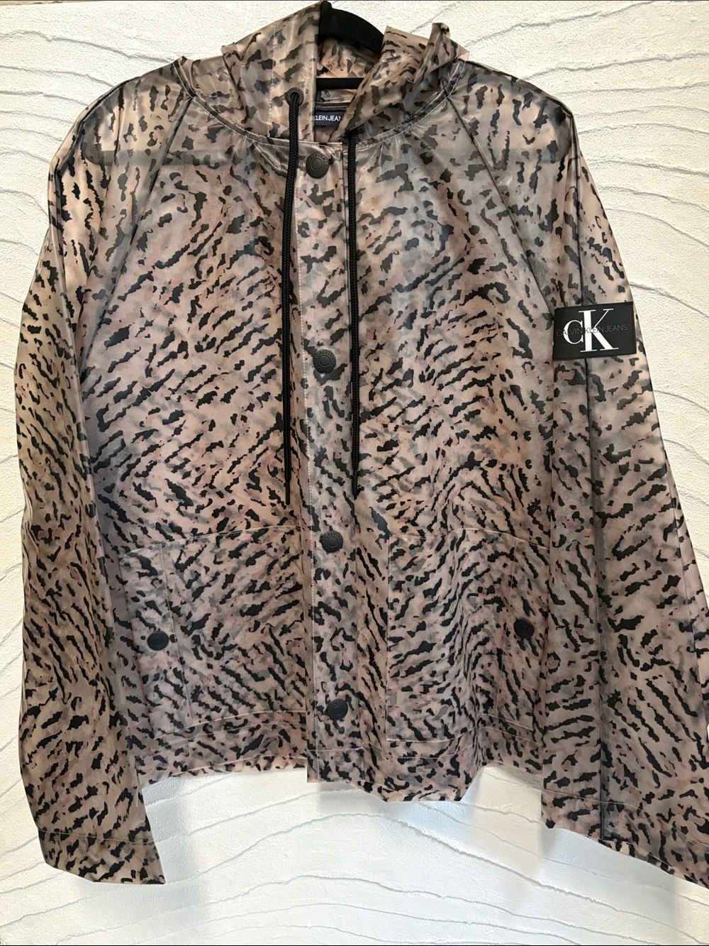 Hooded Calvin Klein Rain Jacket with pockets and animal print design